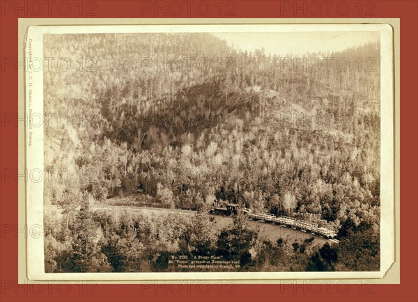 A pretty view. At picnic grounds on Homestake Road, John C. H. Grabill was an american photographer. In 1886 he opened his first photographic studio