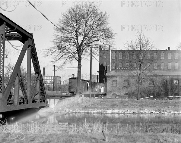 Mt. Holyoke, Massachusetts - Scenes. A very old independent paper mill, wood pulp, not rags, continuing site and ownership in relatively straight line, once connected with a wood pulp mill near to Hoosie Tunnel; the type of near-to-mill transportation; the canal; glimpse of most modern mill type in background. Franklin Paper Company. Farr Alpaca - No. 4, 1936, Lewis Hine, 1874 - 1940, was an American photographer, who used his camera as a tool for social reform. US,USA