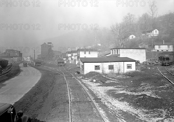 Scott's Run, West Virginia. Pursglove Mines Nos. 3 and 4 - This is the largest company of Scott's Run. Scene shows main Scott's Run Highway and atmosphere loaded with coal dust and typical of Scott's Run on any working day, March 1937, Lewis Hine, 1874 - 1940, was an American photographer, who used his camera as a tool for social reform. US,USA