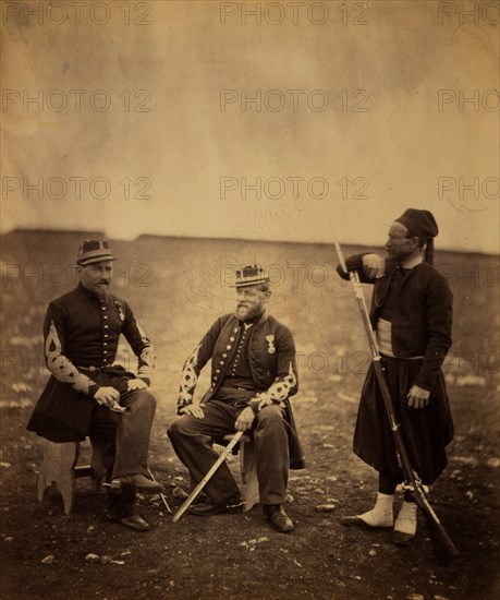 Two French officers, seated, and Zouave, standing with arm resting on rifle, Crimean War, 1853-1856, Roger Fenton historic war campaign photo