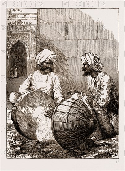 PREPARING FOR THE PRINCE: TUNING THE TOM-TOMS AT JAMMU, INDIA, 1876