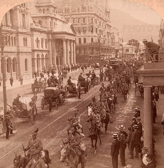 South African Light Horse coming down Adderly Street, to entrain for the front, Cape Town, South Africa. Vintage photography 1900, Vintage photography