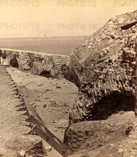 Interior of Fort Sumpter (i.e. Sumter), looking toward Charleston. Fort Sumter is a Third System masonry sea fort located in Charleston Harbor, South Carolina. The fort is best known as the site upon which the shots that started the American Civil War were fired, at the Battle of Fort Sumter on April 12, 1861. , Vintage photography