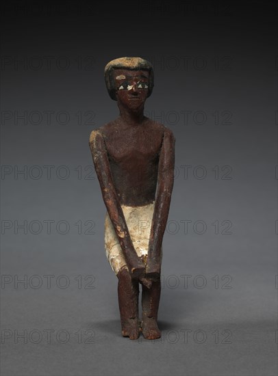 Seated Model Sailor, c. 2000-1000 BC. Egypt, Middle Kingdom, late Dynasty 11 (2040-1980 BC) to early Dynasty 12 (1980-1951 BC). Painted sycamore fig; average: 11 cm (4 5/16 in.).