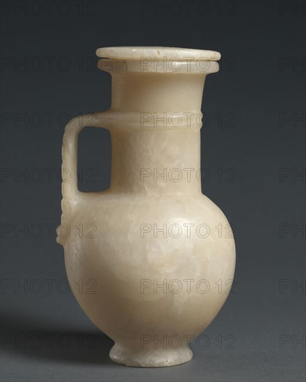 Long-Necked Flask with Strap Handle and Lid, 1401-1353 BC. Egypt, New Kingdom, Dynasty 18, reign of Tuthmosis III, to Amenhotep III, 1479-1353 BC. Travertine; diameter: 9.1 cm (3 9/16 in.); diameter of mouth: 6.8 cm (2 11/16 in.); overall: 16.9 cm (6 5/8 in.).