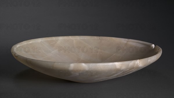 Shallow Dish, c. 2726-2647 BC. Egypt, Saqqara, Old Kingdom, Dynasty 2, reign of Nynetjer or later. Travertine; diameter: 35.9 cm (14 1/8 in.); overall: 8 cm (3 1/8 in.).