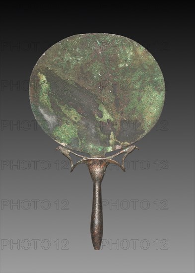 Mirror with Falcons, 1540-1296 BC. Egypt, New Kingdom, Dynasty 18. Mirror of copper, handle of tin-bronze; overall: 18.6 x 11.7 cm (7 5/16 x 4 5/8 in.).