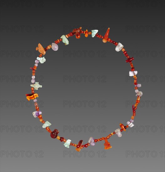Necklace of Amulets, 1980-1801 BC. Egypt, Middle Kingdom, mostly Dynasty 12. Carnelian, feldspar, and amethyst; overall: 19.5 cm (7 11/16 in.).