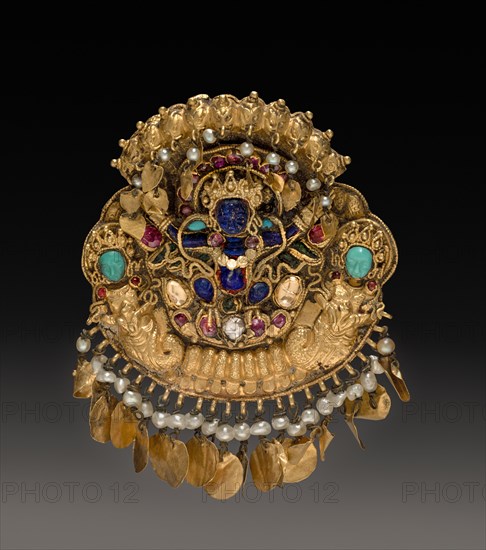 Pendant with Two-Armed Blue Deity on a Lotus with Nagas (serpent divinities), 17th Century. Nepal, Kathmandu Valley. Gold with lapis lazuli and turquoise; overall: 6.1 x 4.9 cm (2 3/8 x 1 15/16 in.).