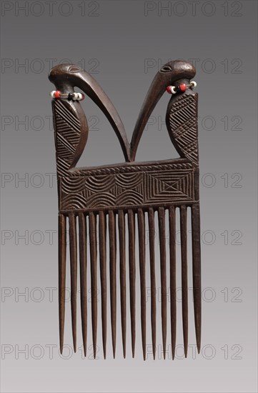Comb, mid-late 1800s. Central Africa, Angola or Democratic Republic of the Congo, Chokwe peoples, mid-late 19th century. Wood, beads; overall: 13.3 x 8 x 1.4 cm (5 1/4 x 3 1/8 x 9/16 in.)