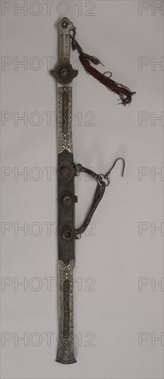 Sword, 1800s. Eastern Tibet. Iron and silver with bone, turquoise, leather and brass; overall: 79.4 cm (31 1/4 in.); blade: 66.7 cm (26 1/4 in.).