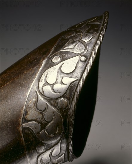 Black and White Elbow Gauntlet for the Right Hand, c.1570. North Germany, 16th century. Steel, blackened with leather; overall: 43.2 x 12.7 cm (17 x 5 in.).