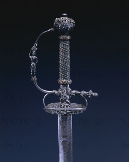Small Sword, c.1650-1660. Netherlands, 17th century. Steel, wood, copper wire; chiseled hilt; engraved blade; overall: 95.3 cm (37 1/2 in.); blade: 78 cm (30 11/16 in.); grip: 11.8 cm (4 5/8 in.); guard: 8.3 cm (3 1/4 in.).