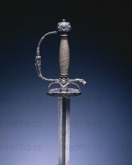 Small Sword with Masks and Figures, c. 1660-1680. Hilt: Holland, blade: Germany, Solingen, 17th century. Steel; chiseling; copper wire; overall: 104 cm (40 15/16 in.); blade: 87.2 cm (34 5/16 in.); grip: 12.5 cm (4 15/16 in.); guard: 7.6 cm (3 in.).