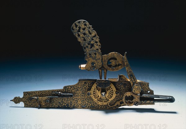 Wheel-Lock from a Hunting Rifle, c. 1660-1720. Austria, late 17th-early 18th Century. Steel, inlaid with gold design of Hapsburg eagle, pierced and chiseled; overall: 30.7 x 17.2 cm (12 1/16 x 6 3/4 in.).