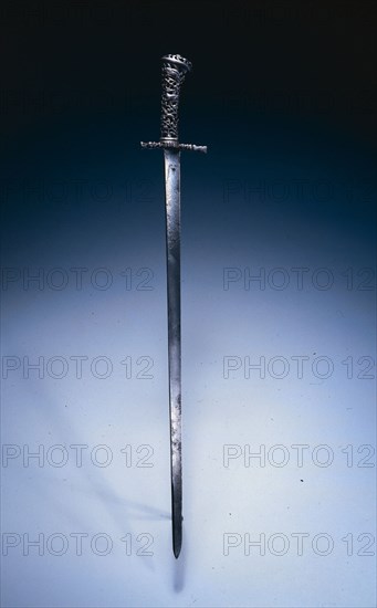 Hunting Sword, c. 1760-1770. Netherlands, 18th century. Steel; pierced and chiseled cast-iron hilt ; blade engraved; overall: 65 cm (25 9/16 in.); blade: 52.9 cm (20 13/16 in.); quillions: 8.9 cm (3 1/2 in.); grip: 11.6 cm (4 9/16 in.).