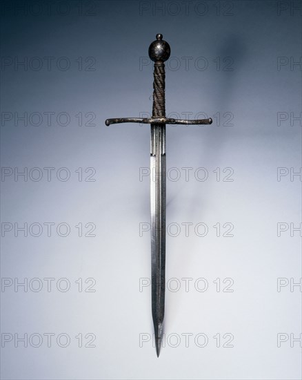 Dagger, c. 1550-1600. Italy, 16th century. Steel; russetted and damascened guard and pommel; wood and wire grip; overall: 50.7 cm (19 15/16 in.); blade: 36.5 cm (14 3/8 in.); quillions: 16.5 cm (6 1/2 in.); grip: 13.3 cm (5 1/4 in.).