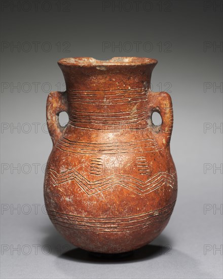 Amphora, c. 2000-1800 BC. Cyprus, Early Cypriot III-Middle Cypriot I. Red ware; diameter: 8 cm (3 1/8 in.); overall: 11.4 cm (4 1/2 in.).