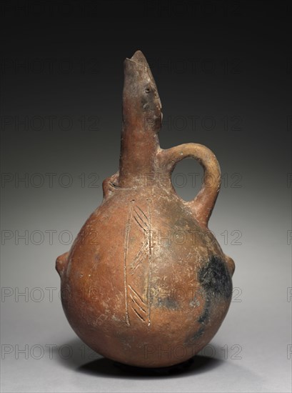 Jug, c. 2000-1800 BC. Cyprus, Early Cypriot III-Middle Cypriot I. Red ware; diameter: 12.5 cm (4 15/16 in.); overall: 22.8 cm (9 in.).
