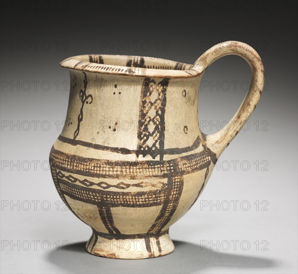 Jug, c. 1450-1200 BC. Cyprus, Late Cypriot II. White slip ware; diameter: 10.3 cm (4 1/16 in.); overall: 13.3 x 11.6 cm (5 1/4 x 4 9/16 in.); diameter of foot: 6.3 cm (2 1/2 in.).