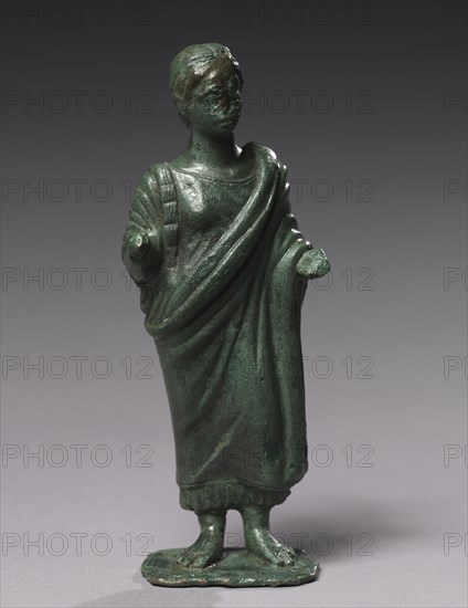 Statuette of Sacrificing Woman, 600-480 BC. Italy, Etruscan, Archaic period. Bronze; overall: 19.1 cm (7 1/2 in.); base: 7.9 cm (3 1/8 in.).