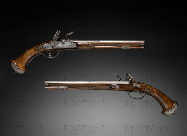 Pair of Flintlock Pistols, c. 1690-1700. Gio Borgognone (Italian), Lazarino Cominazzo (Italian). Steel, chiseled steel with walnut stock; overall: 49.5 cm (19 1/2 in.); barrel: 30.9 cm (12 3/16 in.); bore: 1.3 cm (1/2 in.).