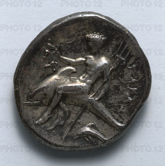 Stater: Taras on Dolphin (reverse), 334-302 BC. Greece, Tarentum, 4th century BC. Silver; diameter: 2.3 cm (7/8 in.).