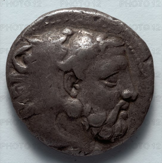 Stater: Head of Bearded Herakles in Lion Skin (obverse), 389-369 BC. Greece, Macedonia, Amyntas III. Silver; diameter: 2.1 cm (13/16 in.).