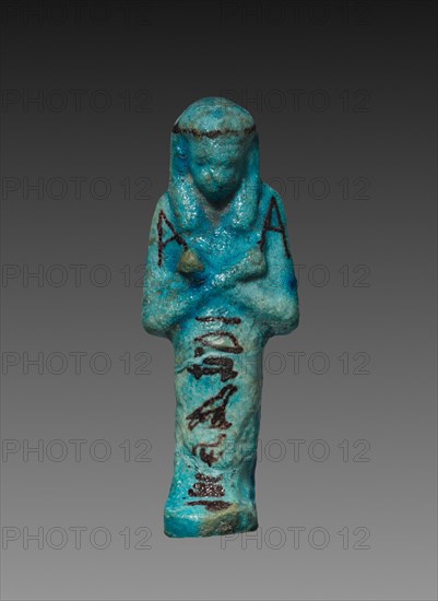 Shawabty, c. 1000-945 BC. Egypt, Third Intermediate Period, probably late Dynasty 21 (1069-945 BC). Turquoise faience with black painted decoration; overall: 8.4 x 3 x 2 cm (3 5/16 x 1 3/16 x 13/16 in.).