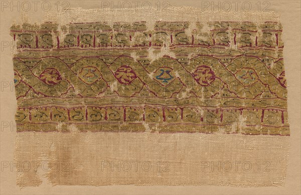 Fragment of a Tiraz-Style Textile, 1130 - 1149. Egypt, Fatimid period, Caliphate of al-Hafiz, AH 524-44 (A.D. 1130 - 1149). Tabby ground with inwoven tapestry ornament; linen and silk; overall: 11.2 x 15.9 cm (4 7/16 x 6 1/4 in.).