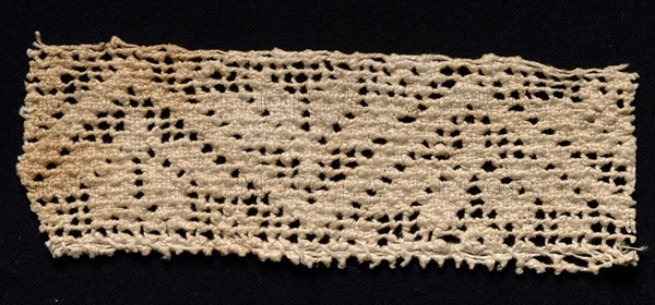 Fragment of a Band with Geometric Motif, 17th-18th century. Spain, 17th-18th century. Needle lace, filet/lacis (knotted ground and darned in two directions); bleached linen (est.); overall: 5.5 x 15.8 cm (2 3/16 x 6 1/4 in.)