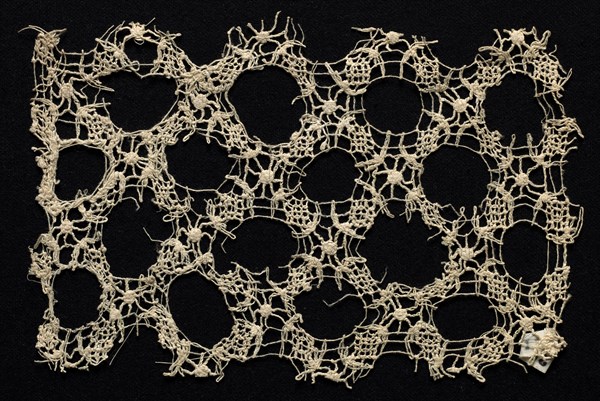 Fragment with Wide Circular Pattern, 16th-17th century. Italy, 16th-17th century. Needle lace, mezza mandolina; bleached linen (est.); overall: 11.4 x 17.5 cm (4 1/2 x 6 7/8 in.)