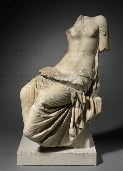 Seated Figure of a Woman, 1-200. Italy, Roman, 1st-2nd Century. Marble; overall: 50.9 x 26.8 cm (20 1/16 x 10 9/16 in.).