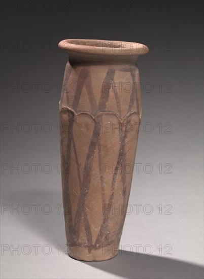 Wavy-Lined Jar, 4000-3000 BC. Egypt, late Predynastic Period, Naqada IIIa2 (Dynasty 0). Marl clay pottery; diameter: 10.1 cm (4 in.); diameter of mouth: 7.5 cm (2 15/16 in.); overall: 26.8 cm (10 9/16 in.).