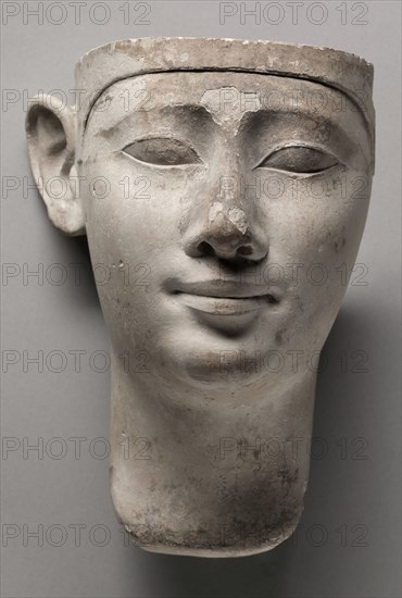 Votive Head of a King, 305-246 BC. Egypt, Early Ptolemaic Dynasty, probably reign of Ptolemy II. Limestone; overall: 21.6 x 16.5 cm (8 1/2 x 6 1/2 in.).
