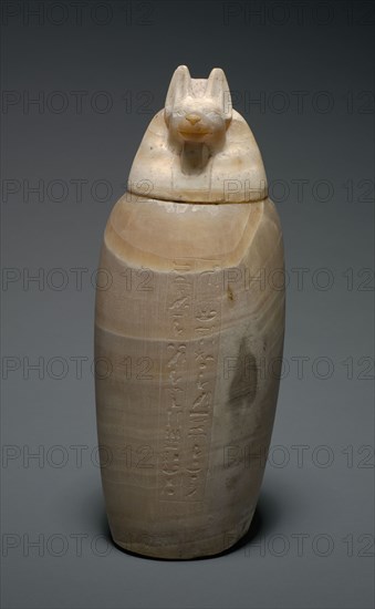 Canopic Jar with Jackal's Head, 664-525 BC. Egypt, Late Period, Dynasty 26. Travertine; diameter: 16.3 cm (6 7/16 in.); diameter of mouth: 9 cm (3 9/16 in.); overall: 42.6 cm (16 3/4 in.).