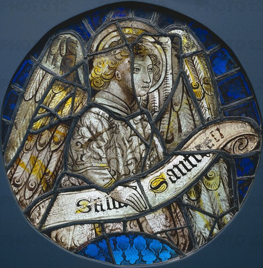 Stained Glass Roundel with an Angel Holding a Scroll, c. 1425-1450. France, 15th century. Stained glass (pot-metal and painted grisaille); diameter: 36.5 cm (14 3/8 in.)