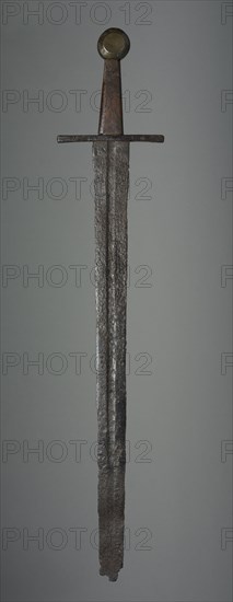 Sword, c. 1350. Germany (?), 14th century. Iron; wood grip and brass pommel replacements; overall: 79.4 cm (31 1/4 in.); blade: 62.9 cm (24 3/4 in.); quillions: 15.3 cm (6 in.); grip: 10.8 cm (4 1/4 in.).