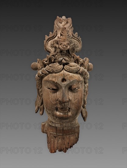 Head of a Bodhisattva, 1100s. China, reportedly from Henan province, Northern Song (960-1127) to Jin dynasty (1115-1234). Wood; overall: 86.4 x 40.6 x 38.1 cm (34 x 16 x 15 in.)