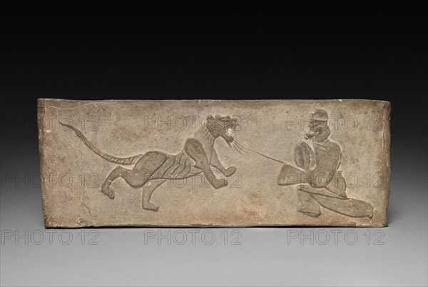 Panel from Model Cooking Stove: Lancer Jousting with a Tiger, 1st Century BC. China, from a tomb in Sian-fu, Shensi province, Western Han dynasty (202 BC-AD 9). Earthenware with impressed relief decoration; overall: 11.4 x 31.1 cm (4 1/2 x 12 1/4 in.).