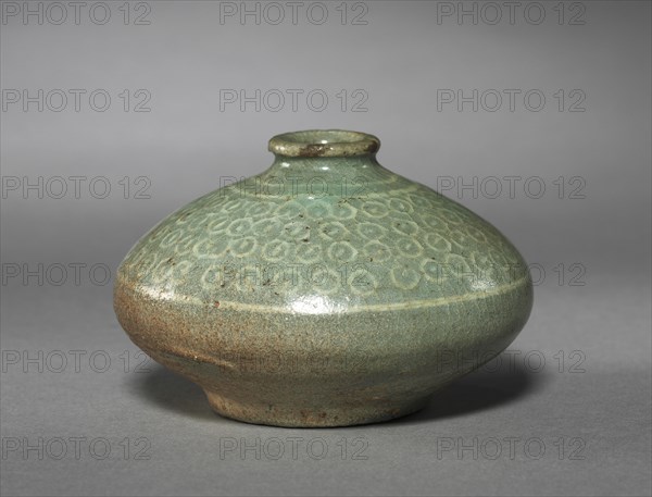 Oil Bottle with Inlaid Dots Design, 1200s-1300s. Korea, Goryeo period (918-1392). Inlaid celadon ware (Mishima ware); outer diameter: 8.3 cm (3 1/4 in.); overall: 5.5 cm (2 3/16 in.).