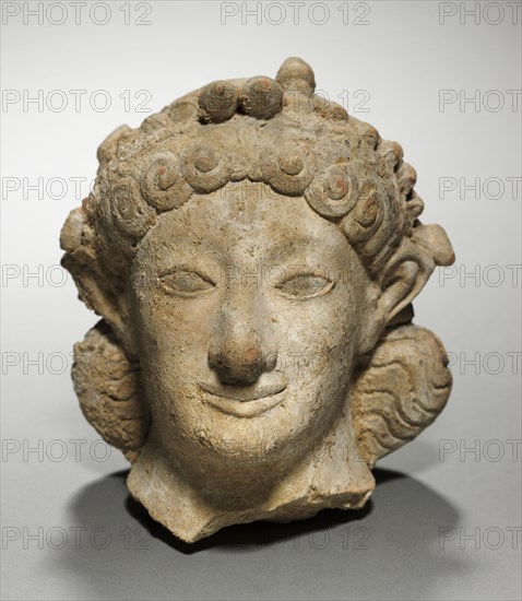 Head of Artemis, 600-575 BC. Greece, late 6th Century BC. Terracotta; overall: 13.8 cm (5 7/16 in.).
