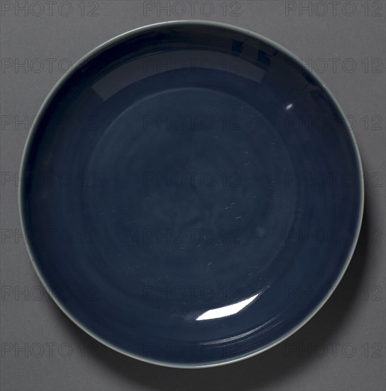 Dish, 1573-1619. China, Jiangxi province, Jingdezhen kilns, Ming dynasty (1368-1644), Wanli mark and reign (1573-1619). Porcelain with blue glaze; diameter: 21 cm (8 1/4 in.).