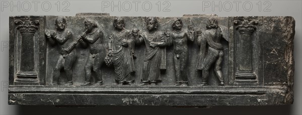 Bacchanalian Relief, 1-100. Pakistan, Gandhara, Buner area, early Kushan Period (AD 1-320). Schist; overall: 16 x 53 cm (6 5/16 x 20 7/8 in.).