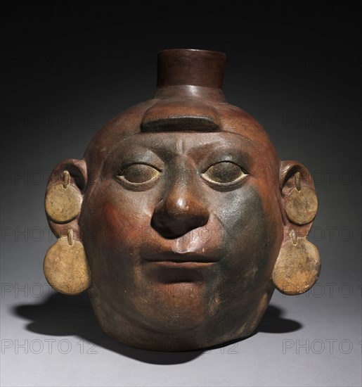 Portrait Head Vessel, 200-550. Peru, North Coast, Moche style (50-800). Earthenware with colored slips; overall: 30.5 x 28.9 x 25 cm (12 x 11 3/8 x 9 13/16 in.).