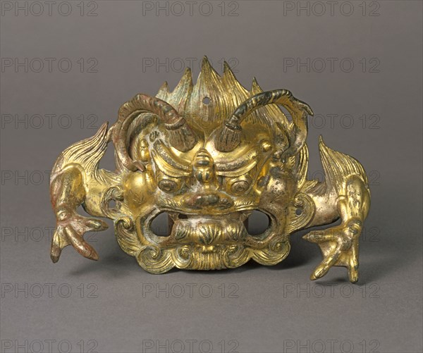 Monster Face: Door Ring Holder (Pushou), 500s. China, Henan province, Northern Dynasties period (386-581). Gilt bronze; overall: 13.6 x 20 cm (5 3/8 x 7 7/8 in.).