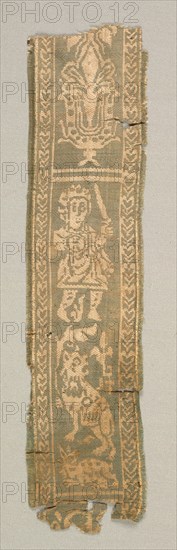 Silk Decorative Tunic Band with a Hunter, 700s. Egypt or Syria, Islamic period, late Umayyad or Abbasid, 8th century. Complementary weft-faced twill with inner warps (samit); silk; overall: 27 x 6.4 cm (10 5/8 x 2 1/2 in.)