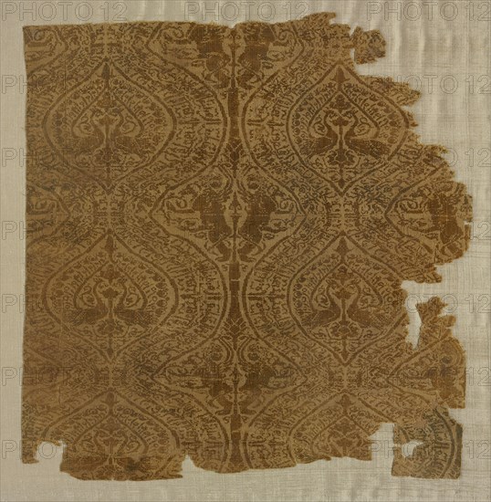 Fragment with peacocks in ogival pattern, 1175-1225. Iran or Iraq. Plain weave with supplementary weft: silk; average: 23.5 x 22.9 cm (9 1/4 x 9 in.)