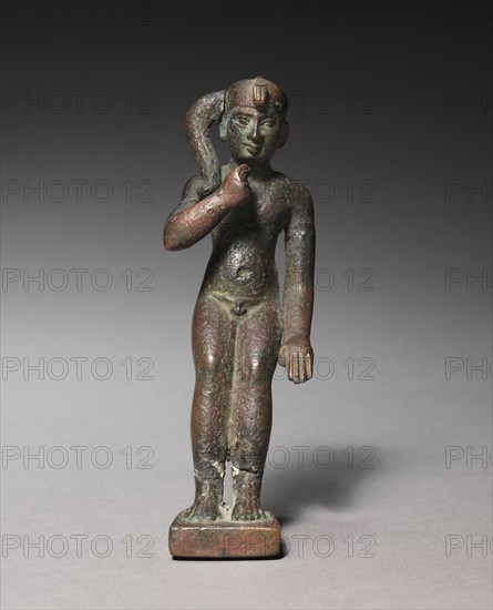 Statuette of Harpocrates, 305-30 BC. Egypt, Greco-Roman Period, probably Ptolemaic Dynasty. Bronze, solid cast; overall: 13.6 x 4.5 x 6.8 cm (5 3/8 x 1 3/4 x 2 11/16 in.).