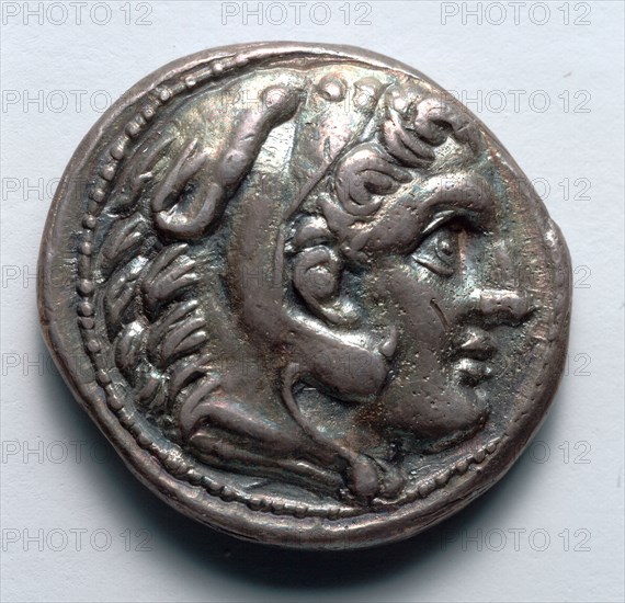 Tetradrachm: Head of Youthful Herakles in Lion's Skin (obverse), 336-323 BC. Greece, Alexander period, 4th century BC. Silver; diameter: 2.6 cm (1 in.).